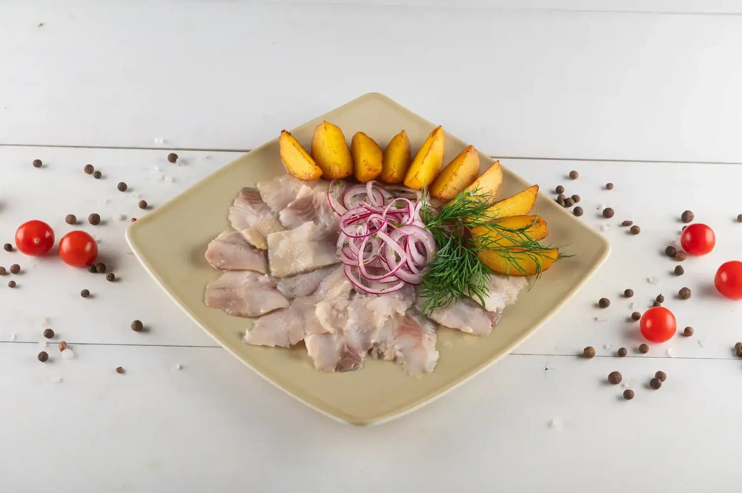 Атлантическая сельдь с картофелем и луком